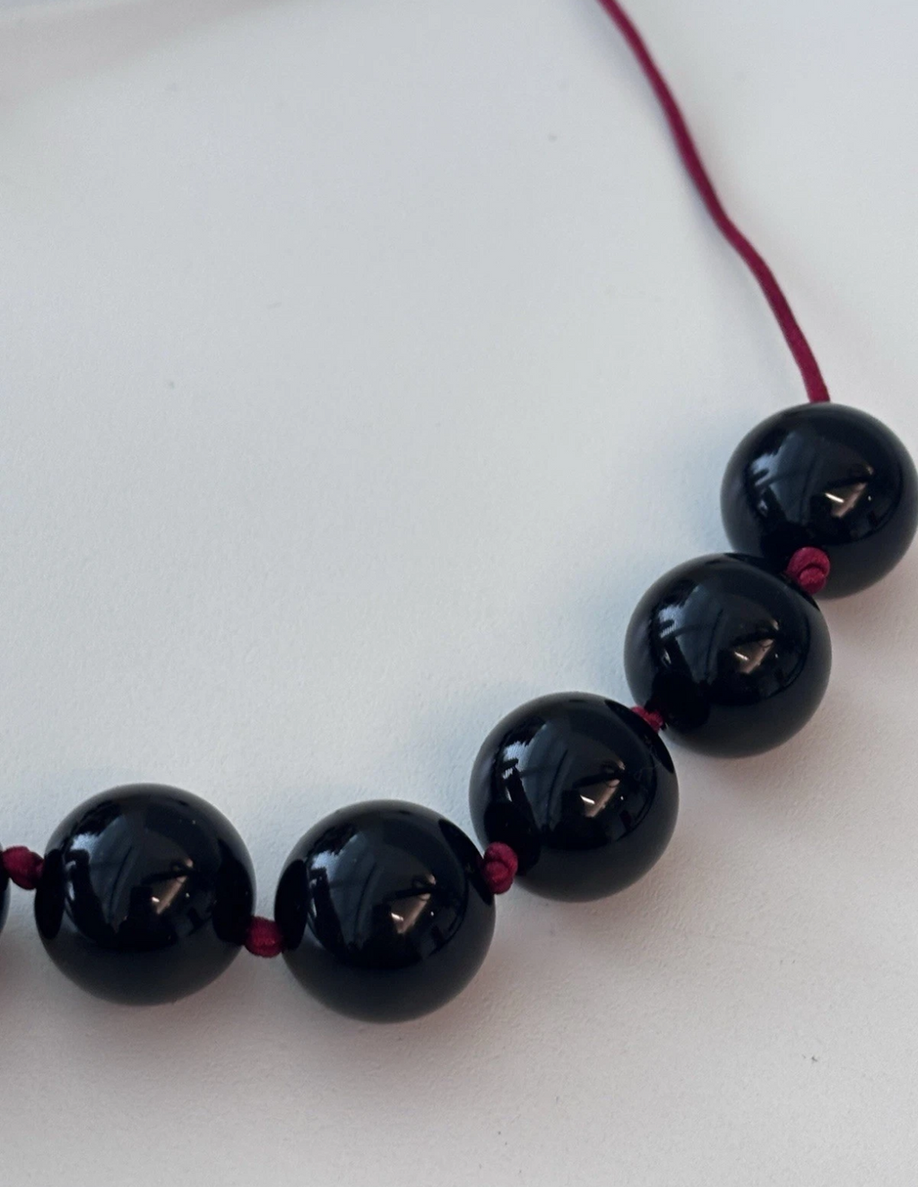 Sphere Necklace Of Black Onyx With Red Cord