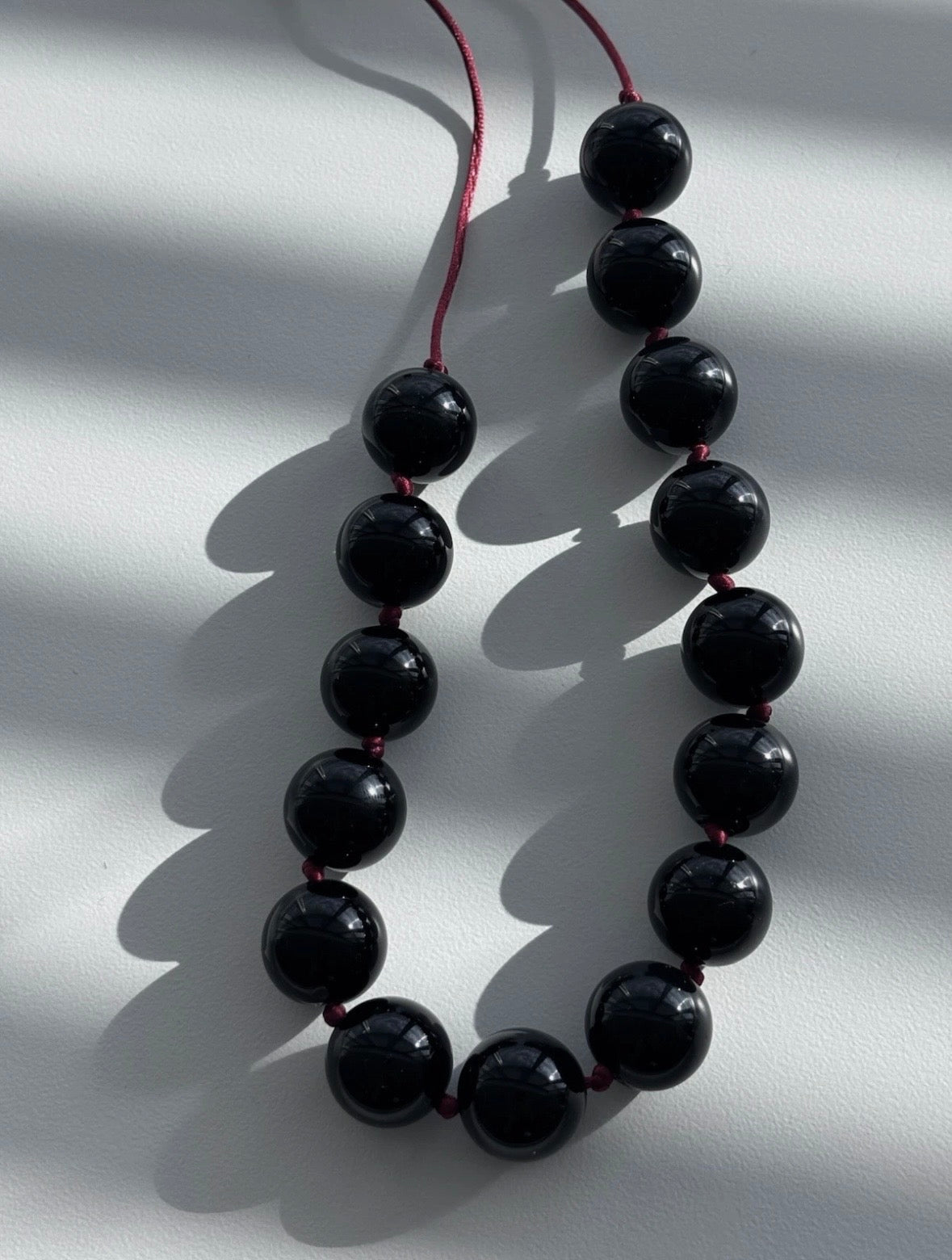 Sphere Necklace Of Black Onyx With Red Cord