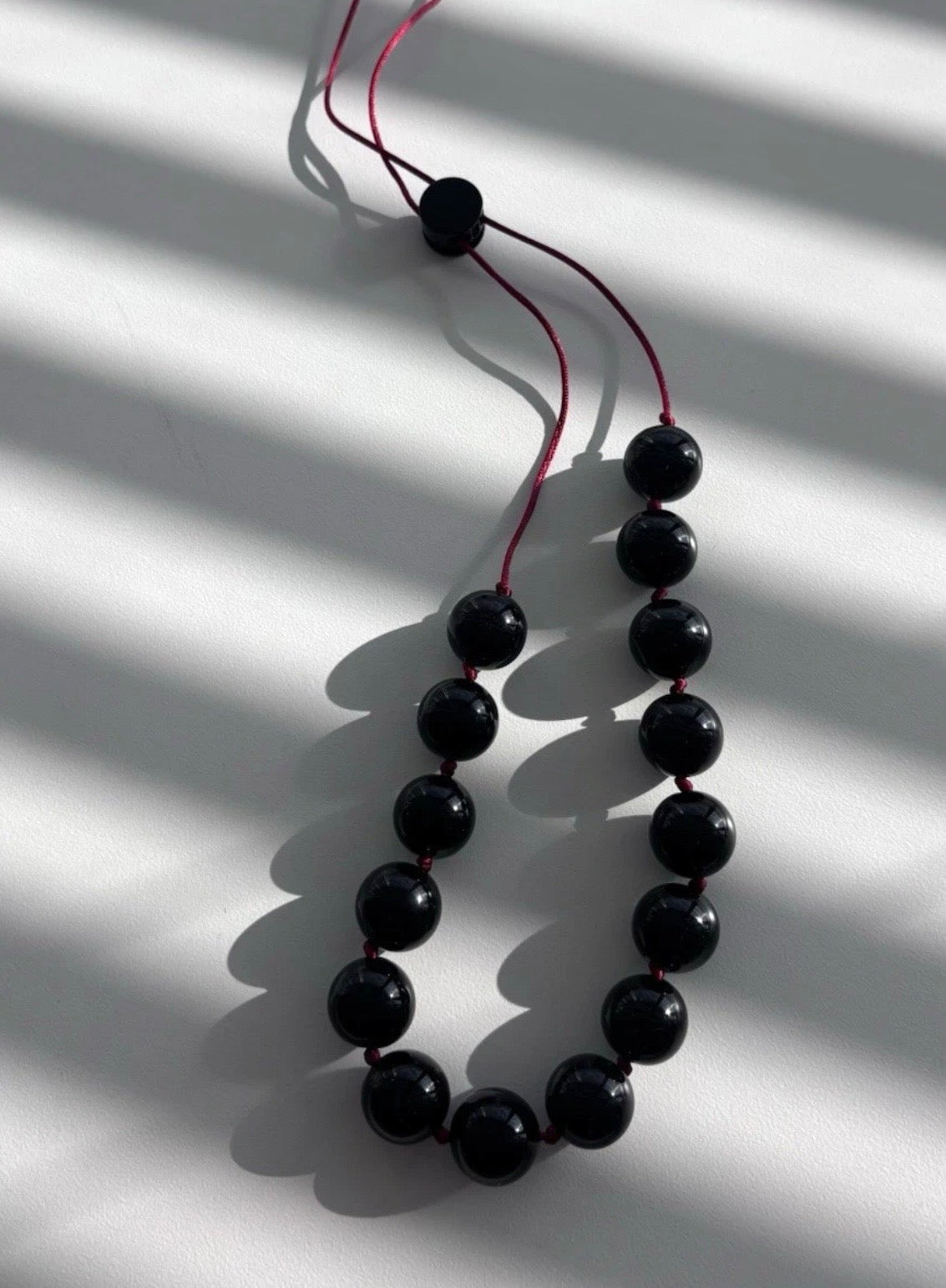 Sphere Necklace Of Black Onyx With Red Cord